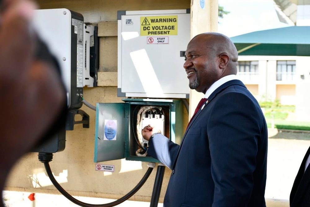 An official operates the switchgear of the solar system at the Parliament Building
