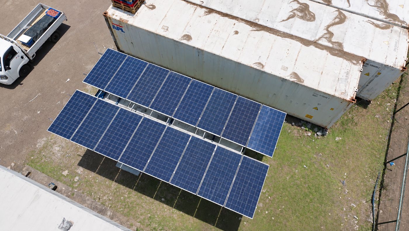 Aerial view of the solar array beside the cold-storage containers on Praslin Island
